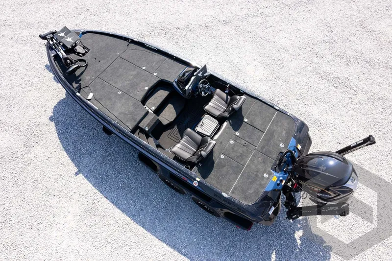 Slide: The Image of 2027 Skeeter FXE21 Apex boat, aerial view, sleek design on gravel surface. - 32