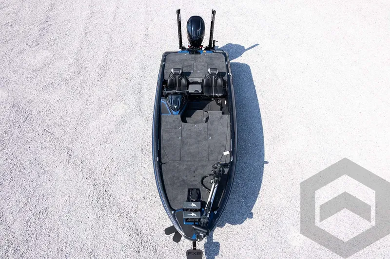 Slide: The Image of Aerial view of 2027 Skeeter FXE21 Apex fishing boat on gravel surface. - 37