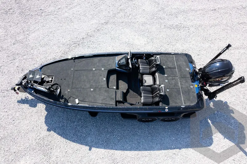 Slide: The Image of 2027 Skeeter FXE21 Apex boat, aerial view, sleek design on gravel surface. - 31