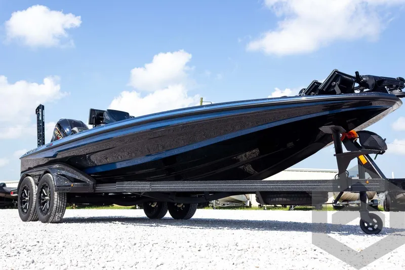 Slide: The Image of 2027 Skeeter FXE21 Apex boat on trailer under blue sky. - 4