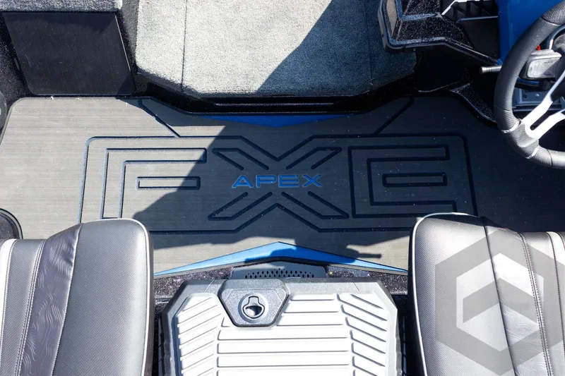 Slide: The Image of 2027 Skeeter FXE21 Apex boat interior with logo on floor mat. - 18