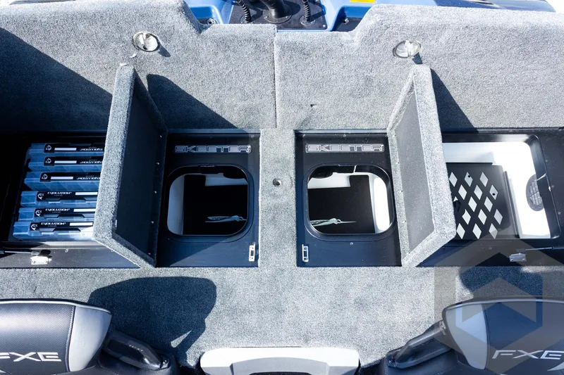 Slide: The Image of 2027 Skeeter FXE21 Apex boat storage compartments with organized fishing gear. - 22