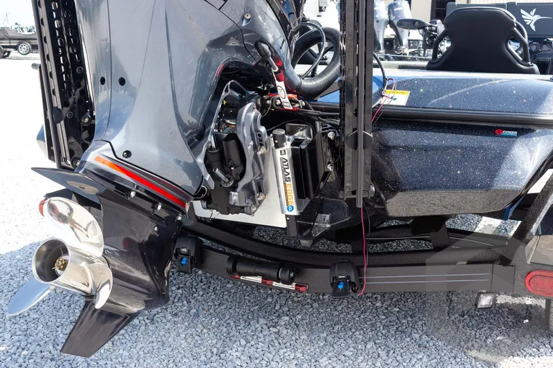 Slide: The Image of 2027 Skeeter FXE21 Apex boat with powerful outboard motor and sleek design. - 12