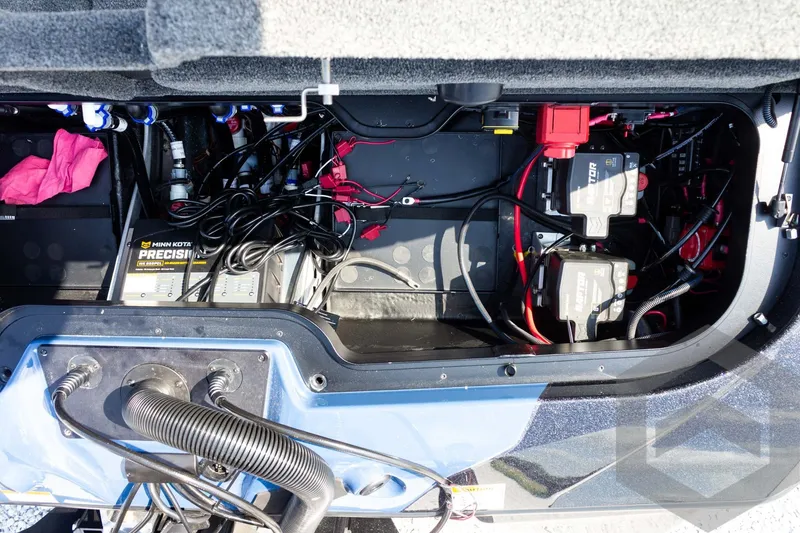 Slide: The Image of Interior view of 2027 Skeeter FXE21 Apex boat's battery and wiring setup. - 26