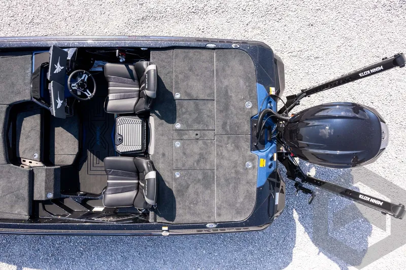 Slide: The Image of Top view of 2027 Skeeter FXE21 Apex boat with dual seats and motor. - 29