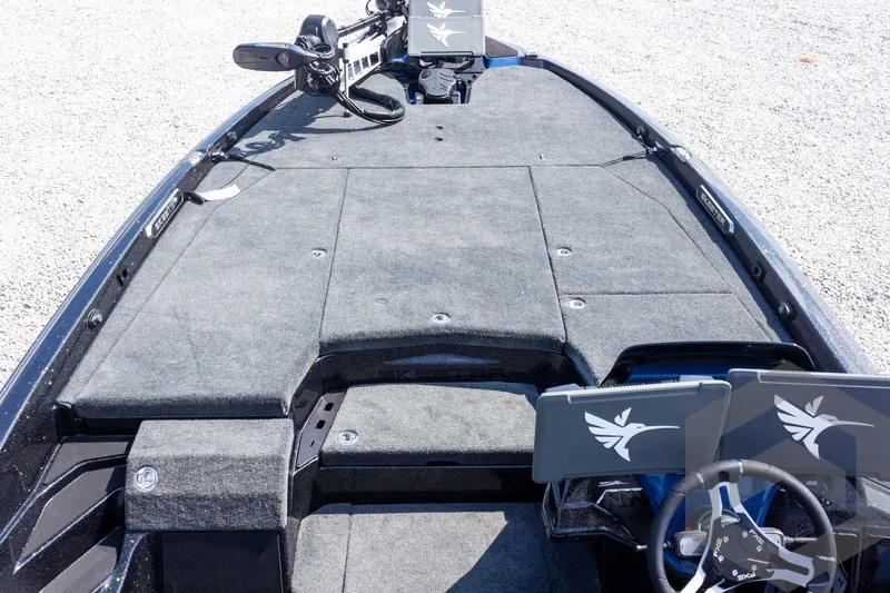 Slide: The Image of 2027 Skeeter FXE21 Apex boat interior with advanced dashboard and spacious deck layout. - 14