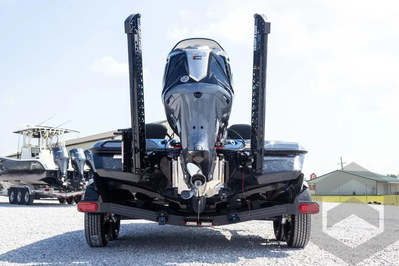 Slide: The Image of 2027 Skeeter FXE21 Apex boat on trailer, rear view with motor and stabilizers. - 7