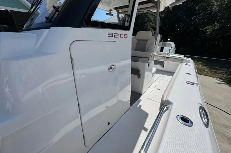 Slide: The Image of 2027 Solace 32CS boat deck with sleek design and modern seating. - 26