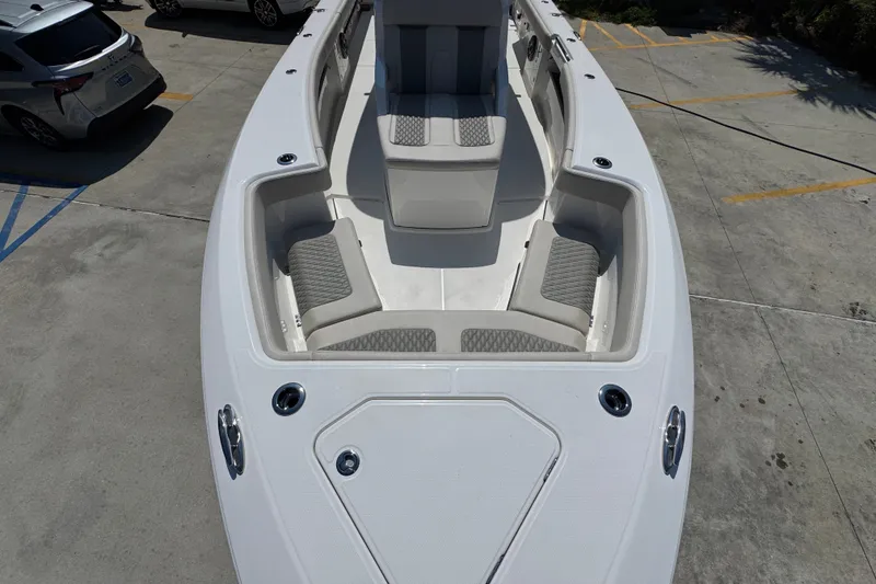 Slide: The Image of 2027 Solace 32CS boat interior with cushioned seating and sleek design. - 22