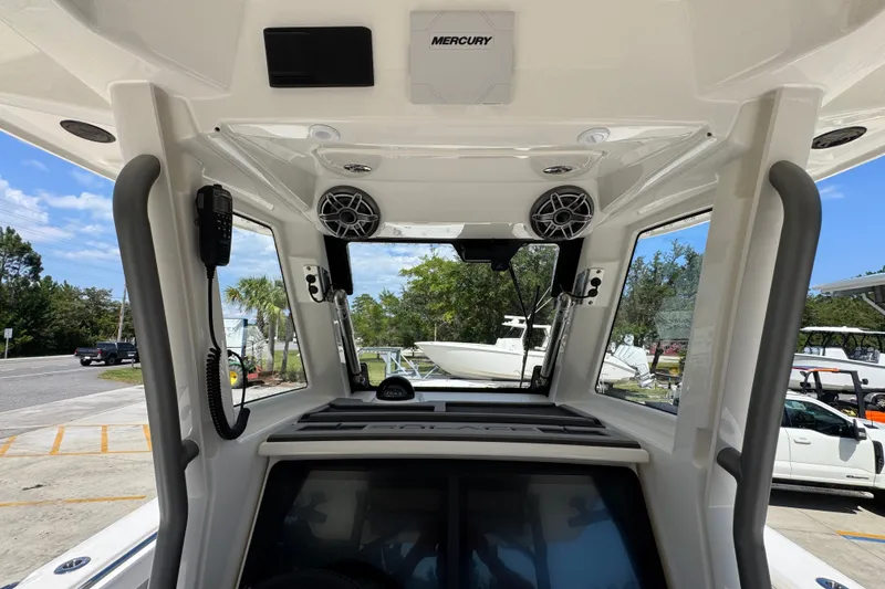 Slide: The Image of Interior view of 2027 Solace 32CS boat, featuring modern controls and speakers. - 40