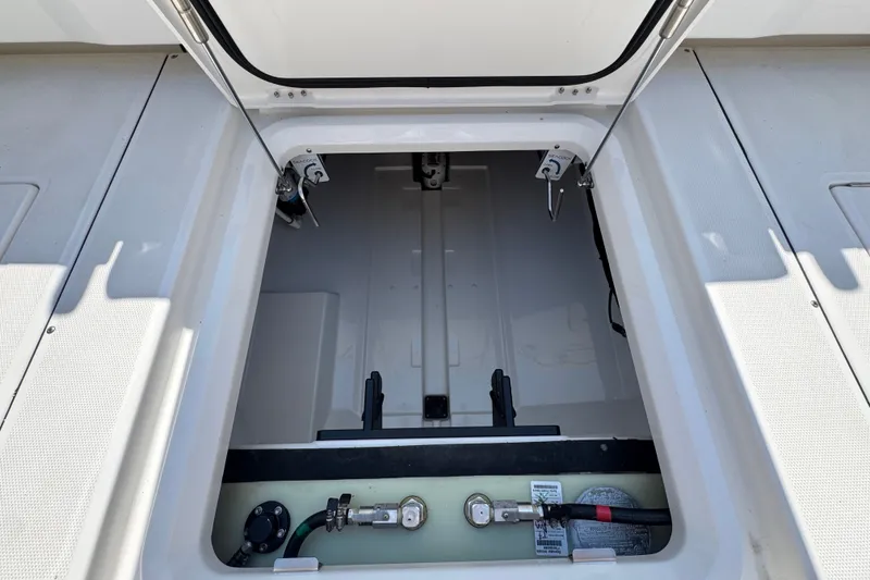 Slide: The Image of Open storage compartment on 2027 Solace 32CS boat, showcasing interior details. - 55