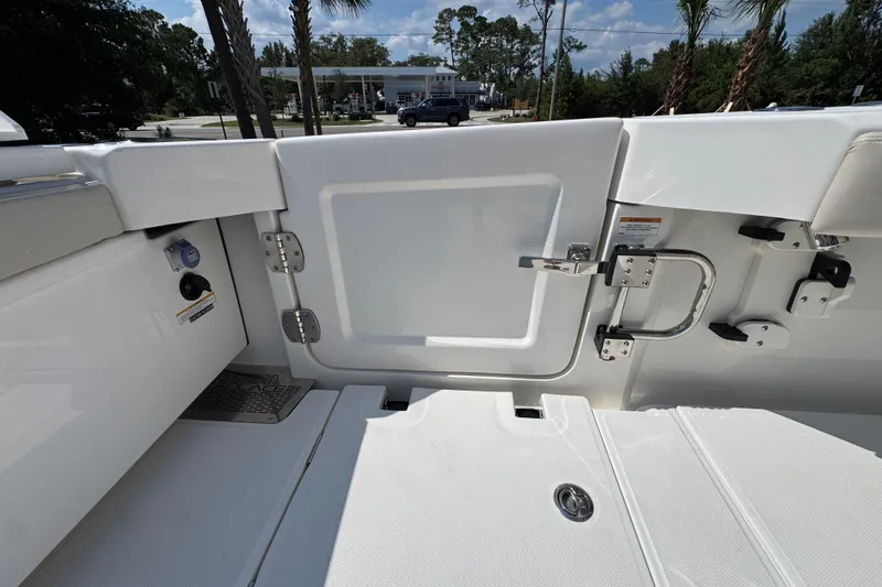 Slide: The Image of Interior view of 2027 Solace 32CS boat, featuring a sleek white door and stainless steel hardware. - 47