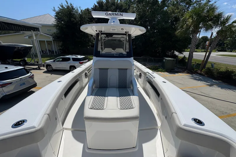 Slide: The Image of 2027 Solace 32CS boat with Garmin equipment, docked in a sunny marina setting. - 24