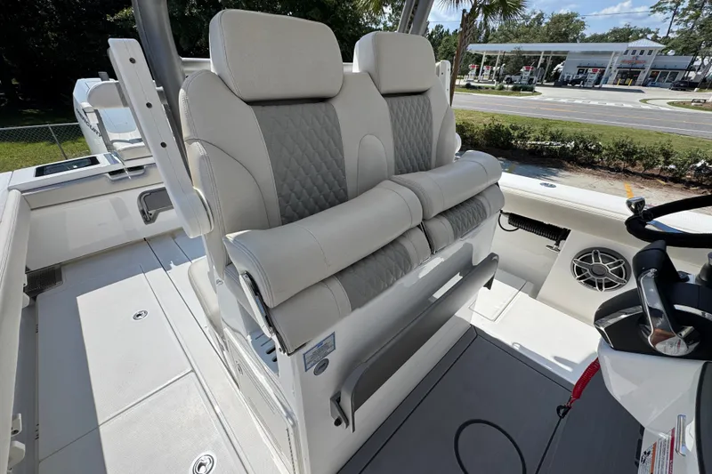 Slide: The Image of 2027 Solace 32CS boat interior with luxurious seating and modern helm controls. - 37