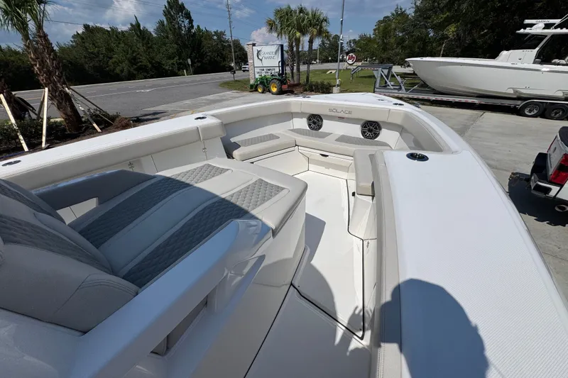 Slide: The Image of 2027 Solace 32CS boat interior with sleek seating and modern design. - 19
