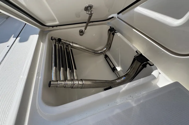 Slide: The Image of Storage compartment with foldable ladder in 2027 Solace 32CS boat. - 56