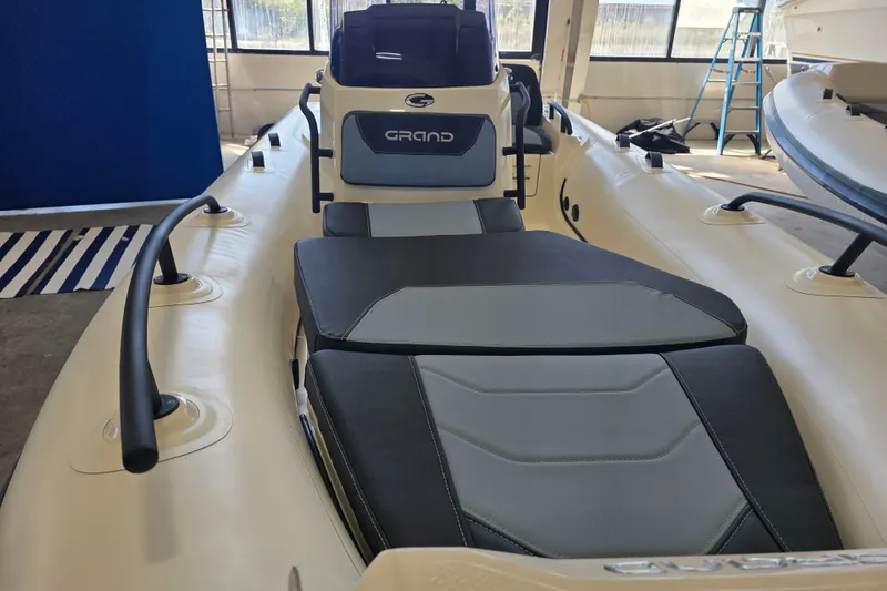 Slide: The Image of 2027 Grand Inflatables G420 boat interior with sleek seating and modern design. - 3