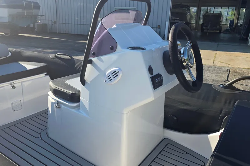 Slide: The Image of 2027 Grand Inflatables G380N boat cockpit with steering wheel and seating. - 9