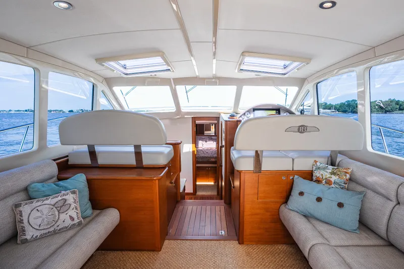 Slide: The Image of Luxurious interior of 2017 Palm Beach Motor Yachts PB42, featuring elegant seating and panoramic windows. - 3