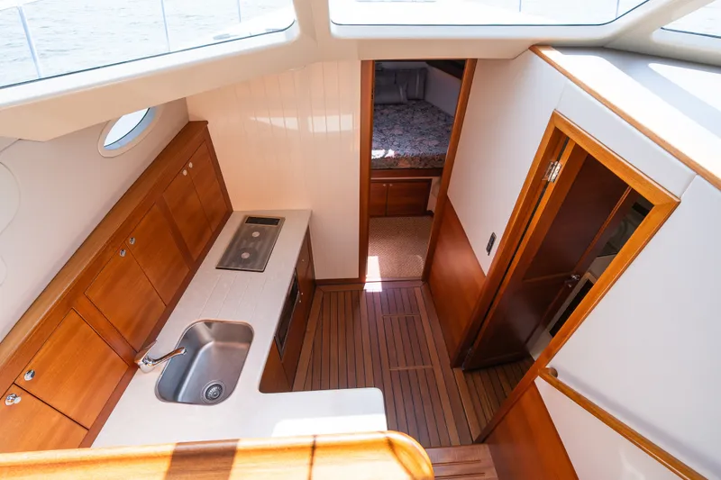 Slide: The Image of Luxurious interior of 2017 Palm Beach Motor Yachts PB42, featuring elegant wood finishes and modern amenities. - 39