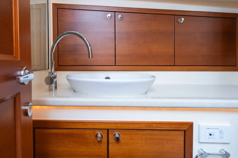 Slide: The Image of Luxurious wooden cabinetry and modern sink in 2017 Palm Beach Motor Yachts PB42 bathroom. - 50