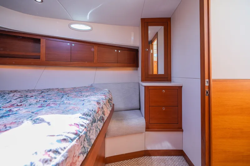 Slide: The Image of Luxurious 2017 Palm Beach Motor Yachts PB42 cabin interior with wood cabinetry and cozy seating. - 47