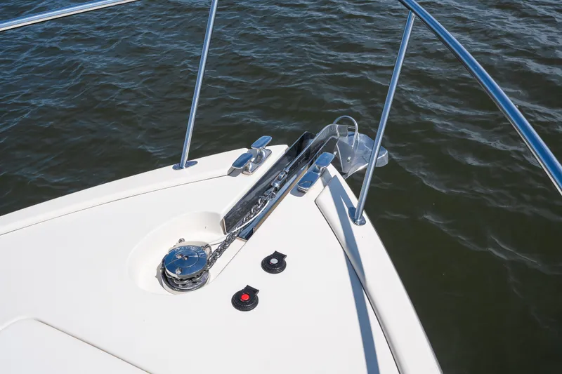 Slide: The Image of Bow of 2017 Palm Beach Motor Yachts PB42 with anchor and railing on water. - 24