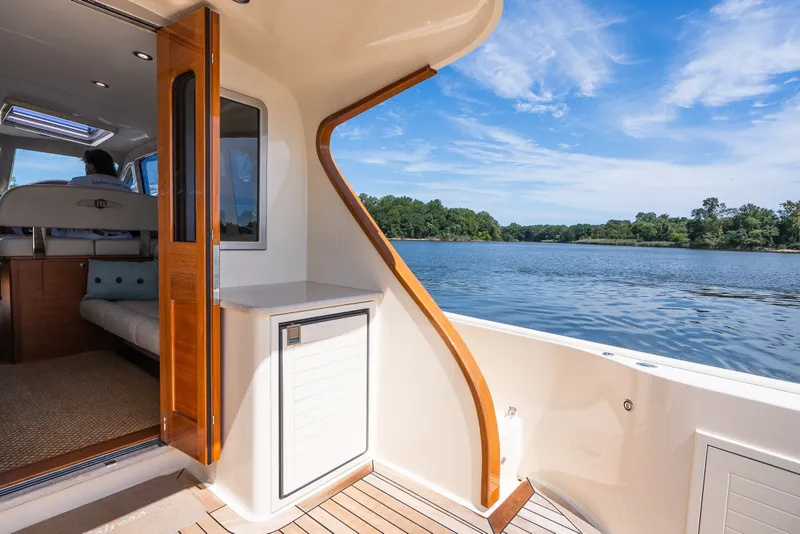 Slide: The Image of 2017 Palm Beach Motor Yachts PB42 interior with scenic water view. - 15