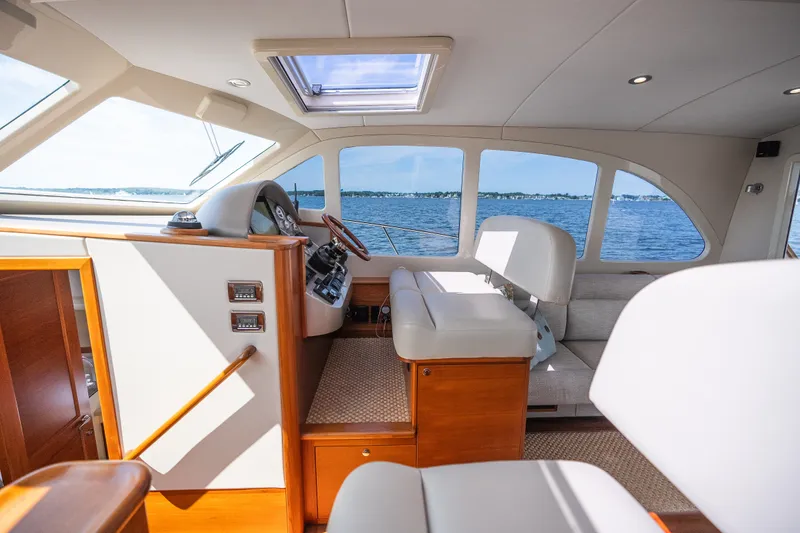 Slide: The Image of Luxurious interior of 2017 Palm Beach Motor Yachts PB42 with elegant seating and panoramic windows. - 35