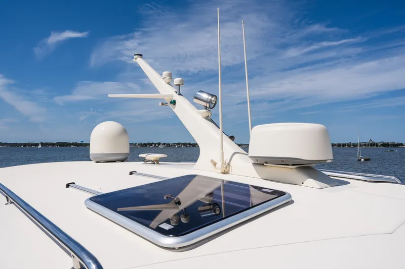 Slide: The Image of 2017 Palm Beach Motor Yachts PB42 on water, showcasing sleek design and advanced navigation equipment. - 26