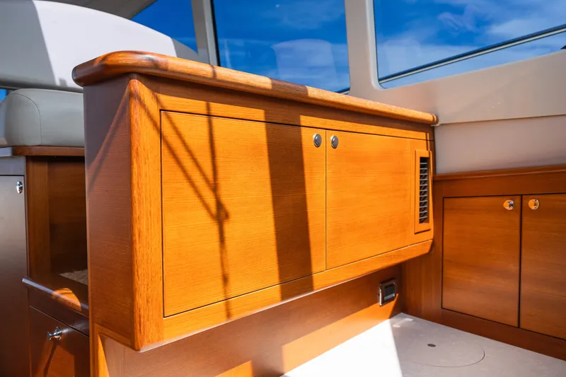 Slide: The Image of Luxurious wooden interior of 2017 Palm Beach Motor Yachts PB42, showcasing elegant cabinetry design. - 43