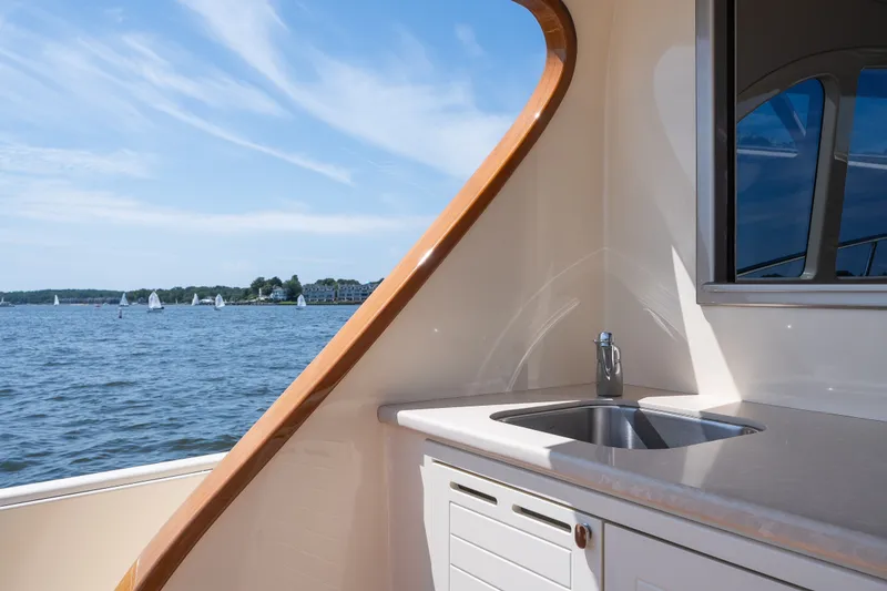 Slide: The Image of Luxurious 2017 Palm Beach Motor Yachts PB42 with sleek outdoor sink and scenic water view. - 14