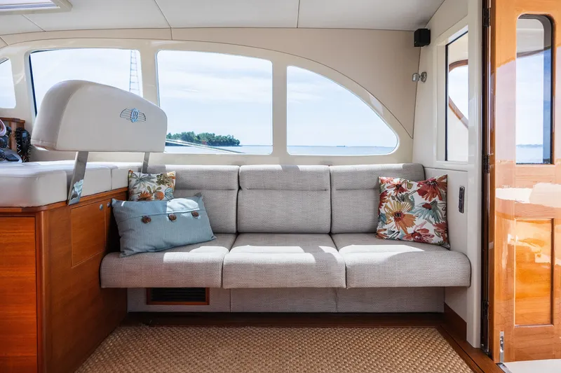 Slide: The Image of Luxurious interior of 2017 Palm Beach Motor Yachts PB42 with elegant seating and floral cushions. - 28