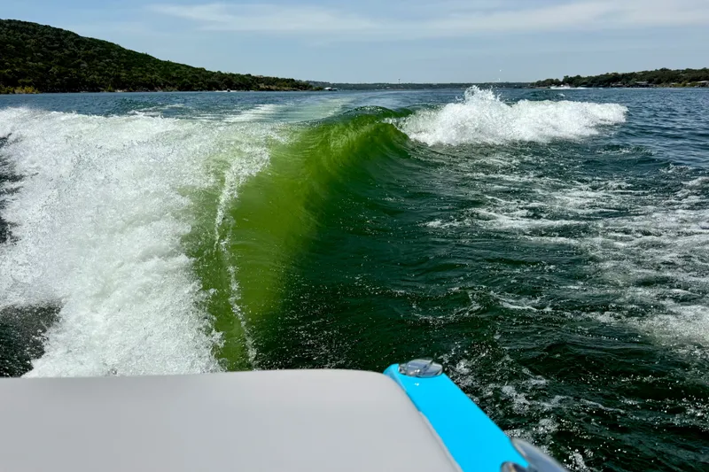 Slide: The Image of Wake created by a 2023 Tige Z3 boat on a scenic lake. - 38