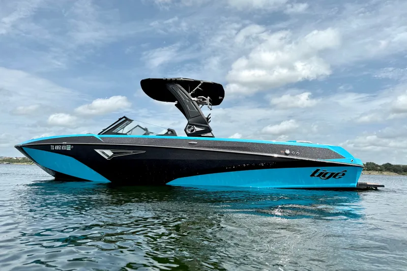 Slide: The Image of 2023 Tige Z3 boat on water, featuring sleek design and vibrant blue accents. - 3
