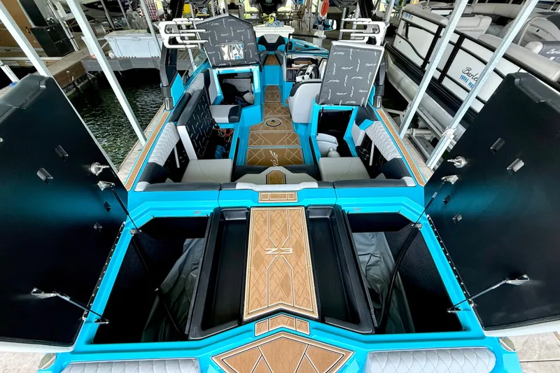 Slide: The Image of 2023 Tige Z3 boat interior with open storage compartments and stylish seating. - 31