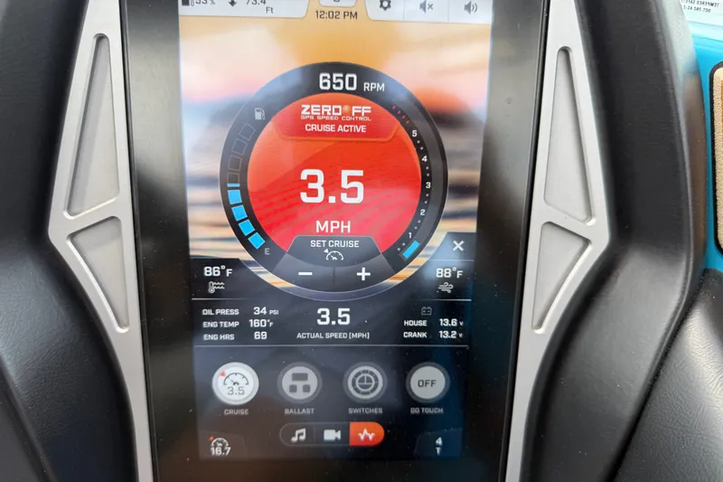 Slide: The Image of Dashboard display of a 2023 Tige Z3 boat showing cruise control settings and engine data. - 20
