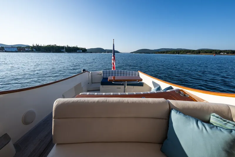 Slide: The Image of Hinckley Picnic Boat 40, 2020 model, cruising on serene waters with scenic views. - 15