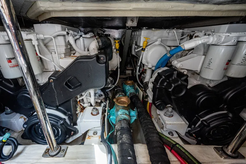 Slide: The Image of Engine room of 2020 Hinckley Picnic Boat 40, showcasing dual engines and mechanical components. - 30