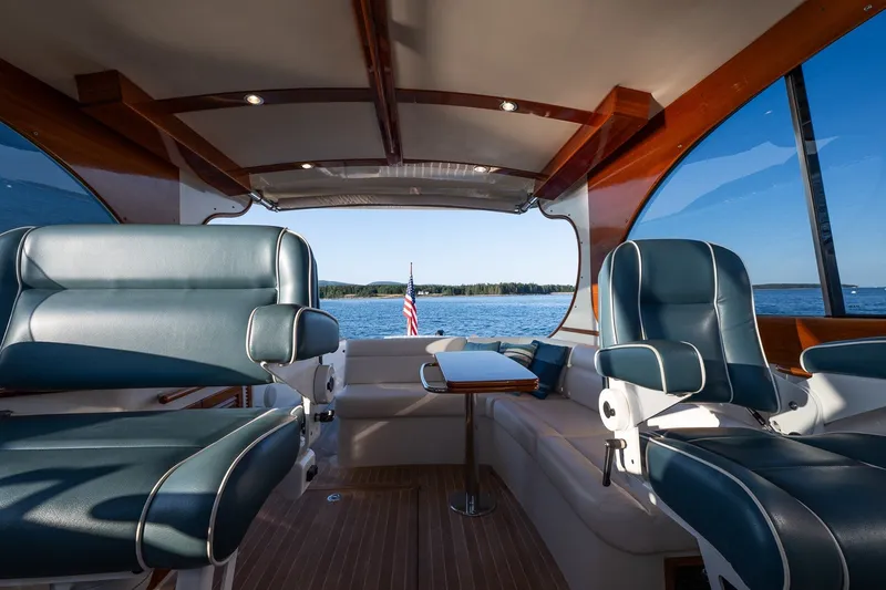 Slide: The Image of Interior of 2020 Hinckley Picnic Boat 40 with luxurious seating and scenic water view. - 18