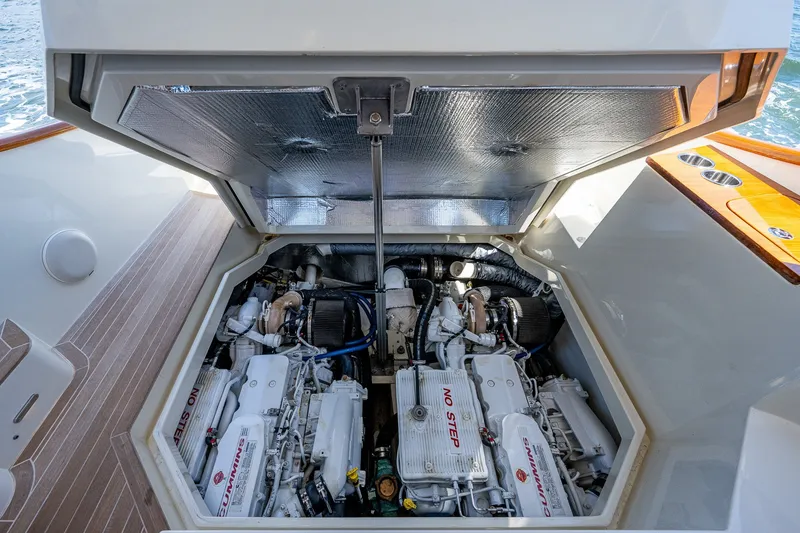Slide: The Image of Engine compartment of a 2020 Hinckley Picnic Boat 40, showcasing dual Cummins engines. - 31