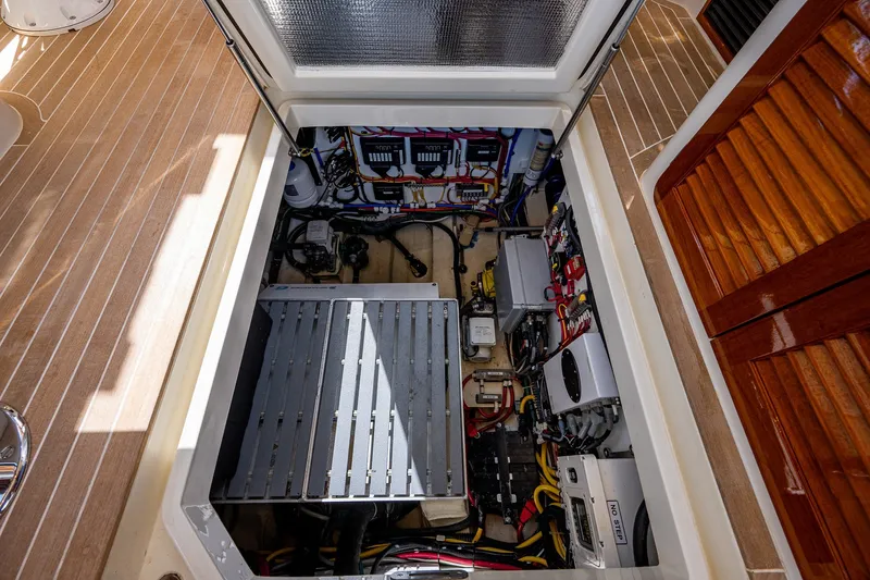 Slide: The Image of Engine compartment of 2020 Hinckley Picnic Boat 40, showcasing wiring and mechanical components. - 29