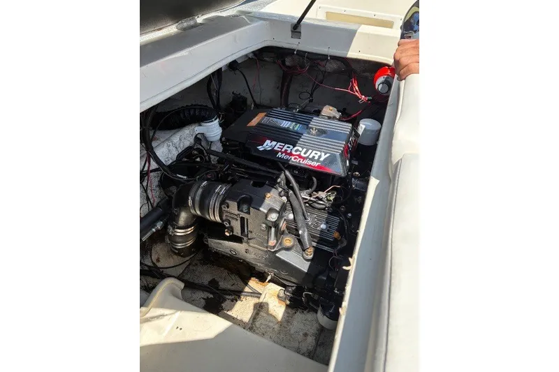 Slide: The Image of Engine compartment of a 2001 Rinker 232 Captiva Bowrider with Mercury MerCruiser engine. - 13