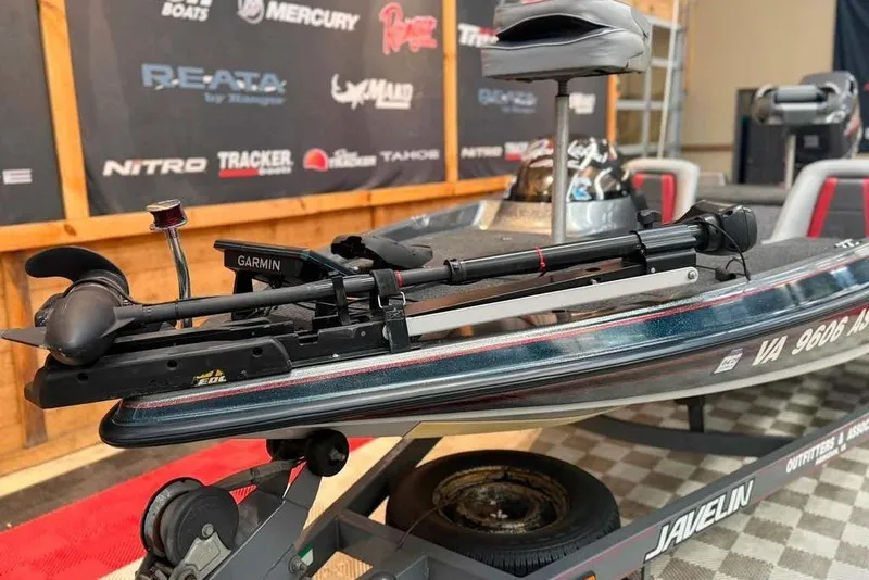 Slide: The Image of 1999 Javelin RENEGADE 18 boat with Garmin equipment on display. - 2