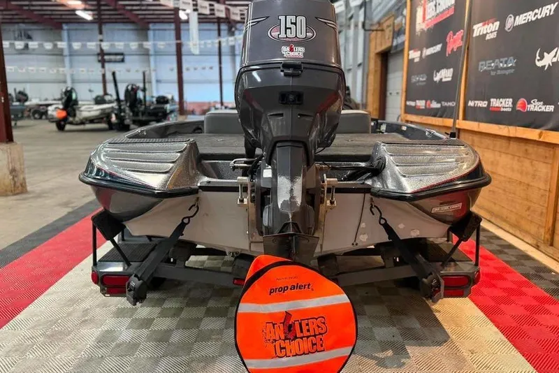 Slide: The Image of 1999 Javelin RENEGADE 18 boat with 150 HP motor in showroom. - 7