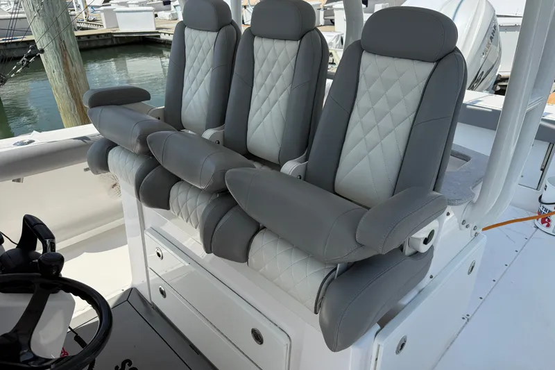 Slide: The Image of Luxury seating on 2022 Everglades 365 Center Console boat, featuring diamond-stitched upholstery. - 48