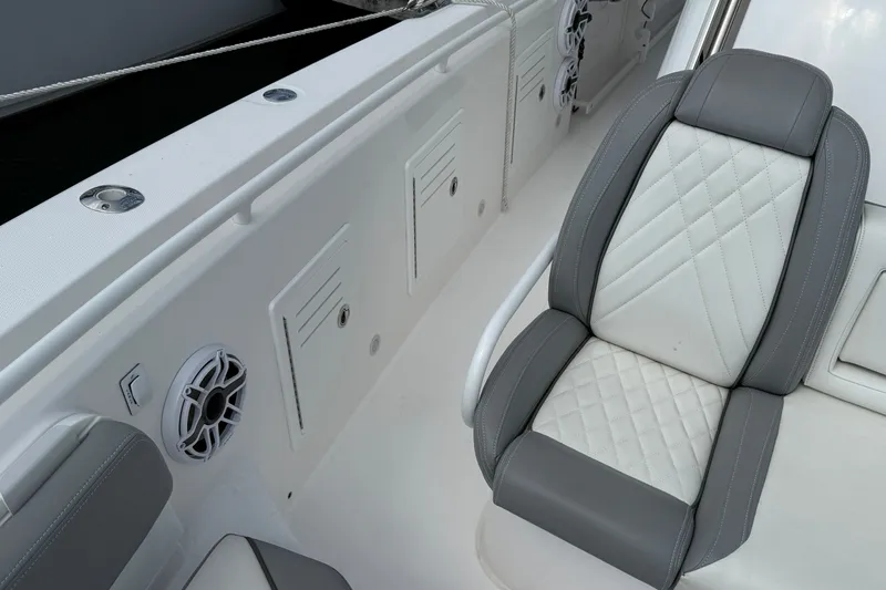 Slide: The Image of Luxury seating on 2022 Everglades 365 Center Console boat with quilted upholstery. - 27