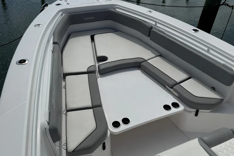Slide: The Image of 2022 Everglades 365 Center Console boat with spacious seating and cup holders. - 23
