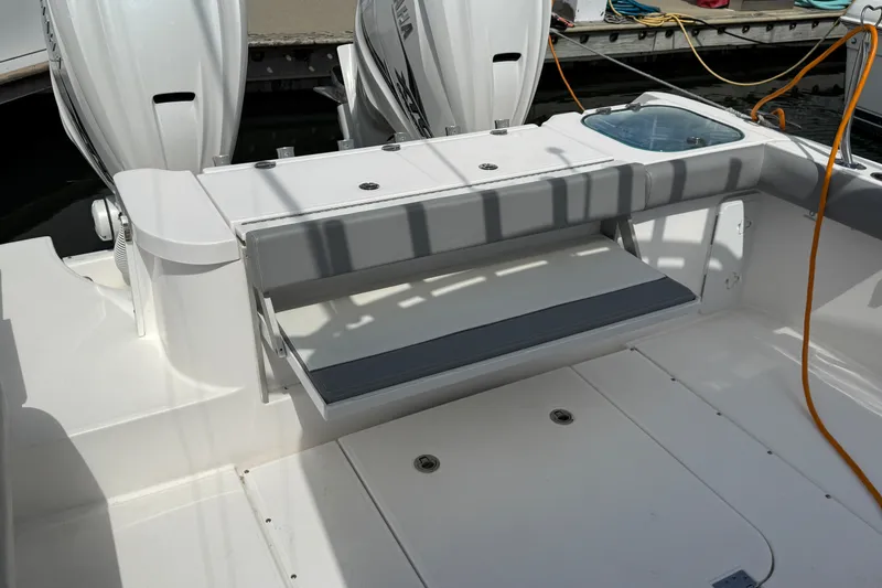 Slide: The Image of 2022 Everglades 365 Center Console boat with dual engines and seating area. - 32