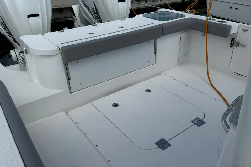 Slide: The Image of 2022 Everglades 365 Center Console boat interior with seating and storage compartments. - 30